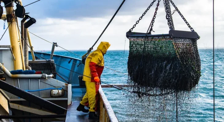 A photo of a fisherman on a commercial fishing boat.